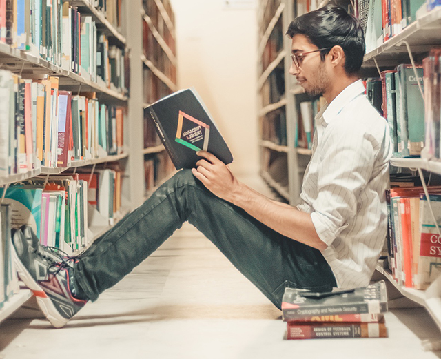 Guy reading book