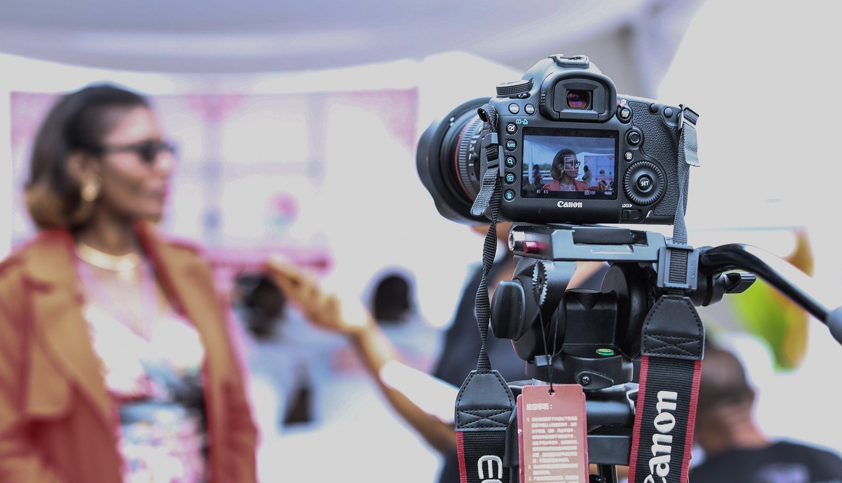 women in front of a camera