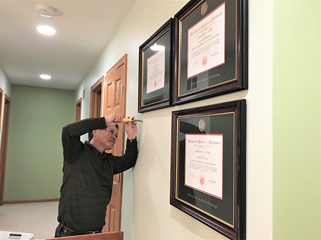 Mr. Chan hanging frames