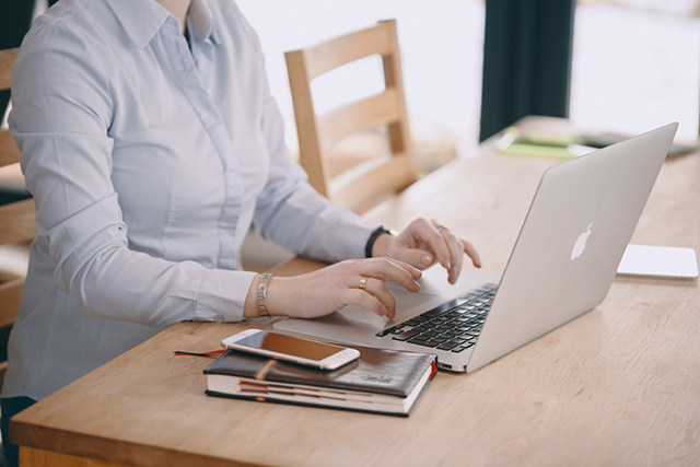 woman on computer at desk