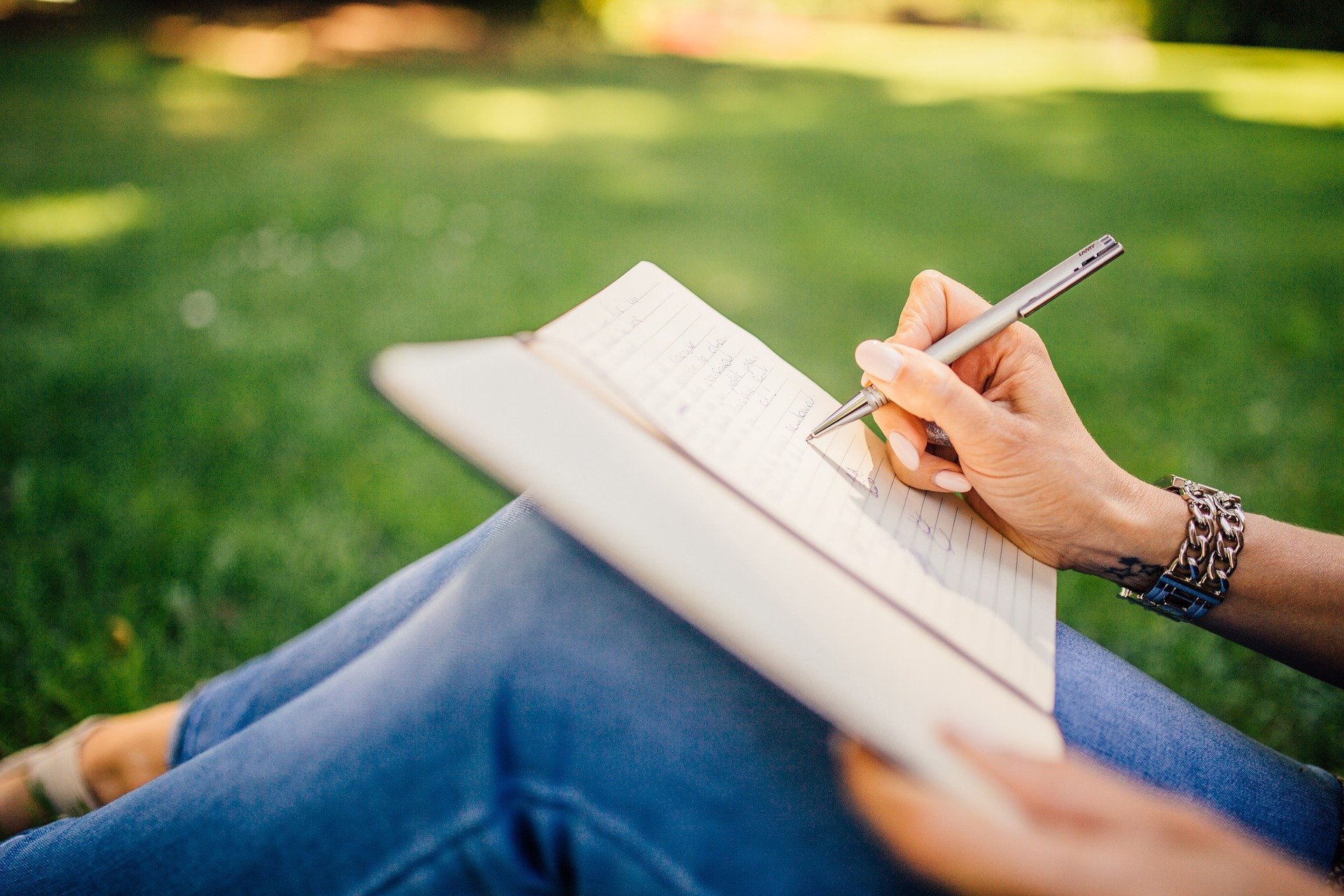 Female writing on her notepad