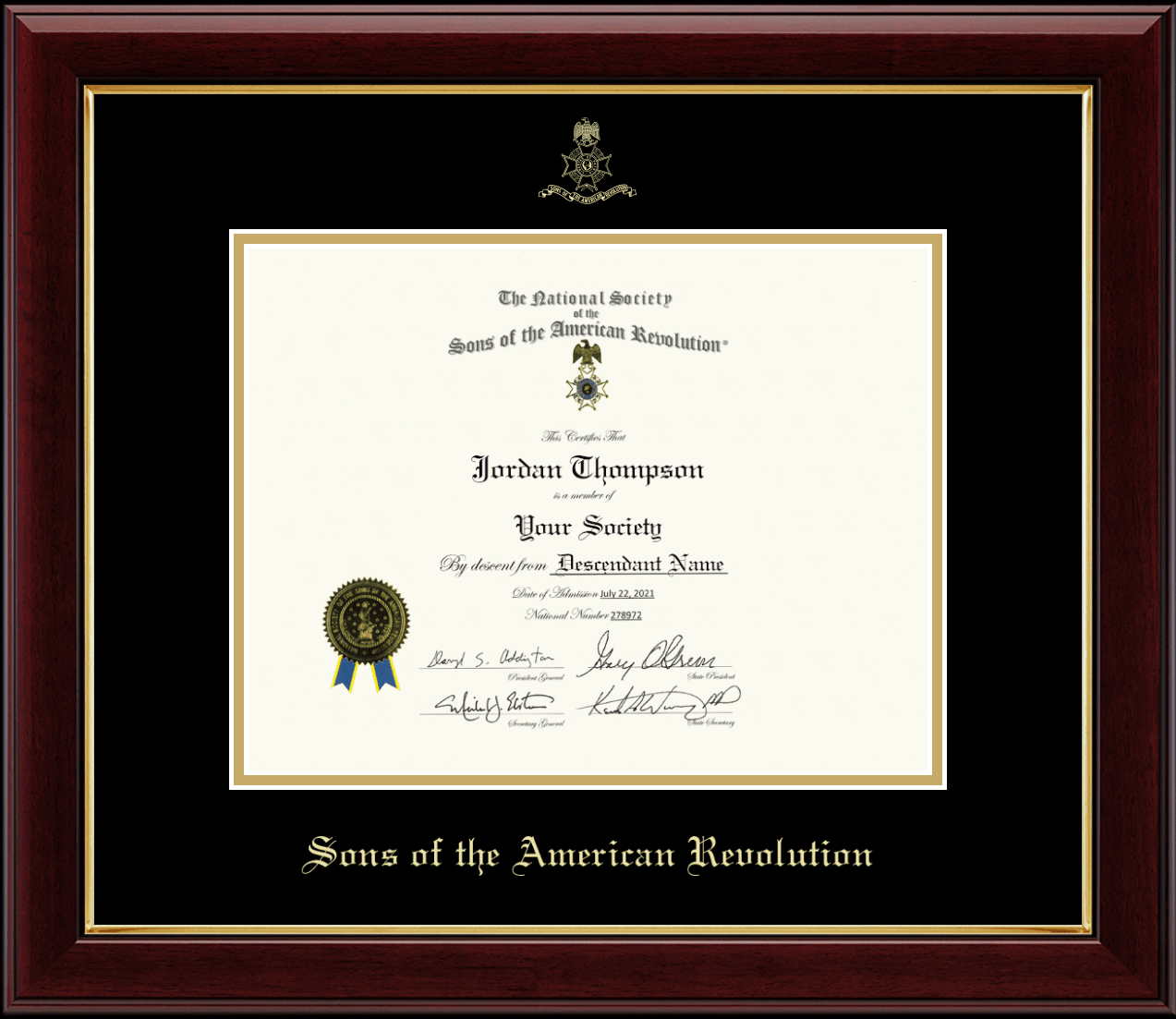 Framed Sons of the American Revolution certificate with dark wood molding, gold inner trim, and black matting. Gold text below the certificate reads ‘Sons of the American Revolution.’